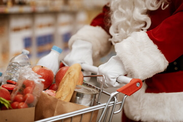 Santa Claus doing grocery shopping at the supermarket