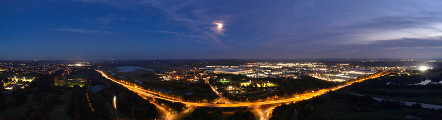 Gorgeous High Angle View of Illuminated British City at Just After Sunset