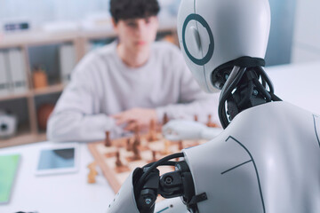 Chess challenge: boy and robot face to face