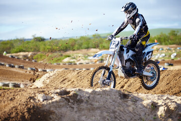 Man, motorcycle or off road race track jump as professional person in action danger, competition or...