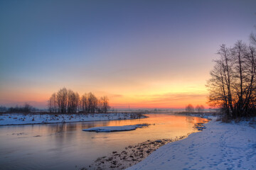 Fototapeta na wymiar Winter landscape, amazing sundown in winter , Poland Europe, river valley Knyszyn Primeval Forest