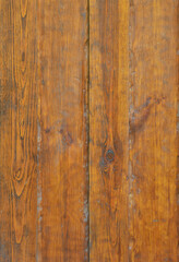 Naklejka premium Texture of the old wooden wall from a number of scratched planks that are varnished