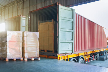 Package Boxes Wrapped Plastic Stacked on Pallets. Loading Truck at Dock Warehouse. Cargo Container,...