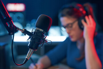Radio presenter working and professional microphone