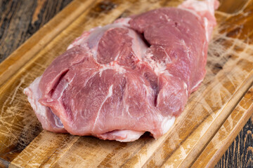 sliced piece of fresh raw pork during salting