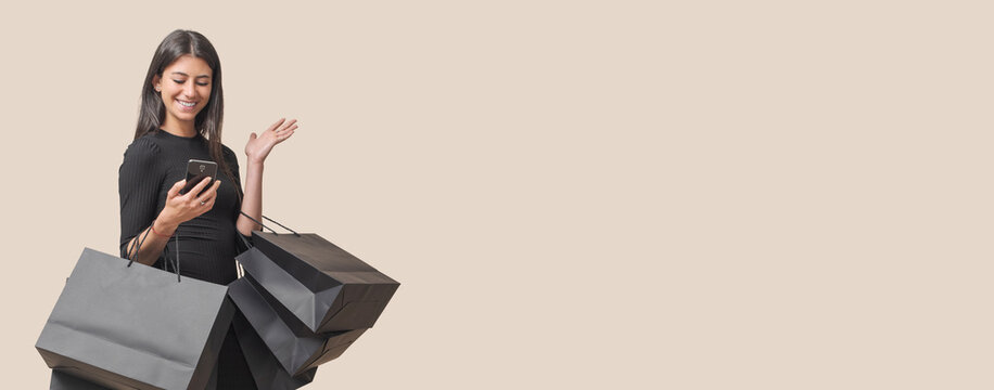 Black Friday sale: woman holding black shopping bags