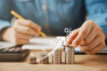 Fotobehang Interest rate and dividend concept, Coins stack with percentage symbol and up arrow, return on stocks and mutual funds, long term investment for retirement. © Thapana_Studio