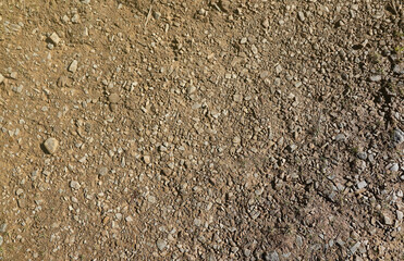 Background of shattered stony stones surface in mountain area. Texture with natural light.