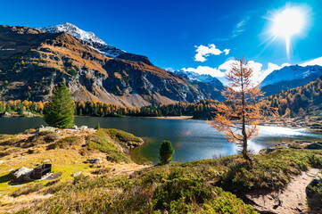A view of the Cavlocc lake, in Engadine, Switzerland, and the mountains surrounding it and with...