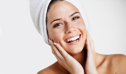Smile, portrait and woman with towel for skincare in a studio for health, wellness and natural face...