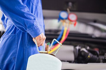 Car Air Conditioning Repair, Technician checked car air conditioning system refrigerant recharge, Repairman check and fixed car air conditioner system