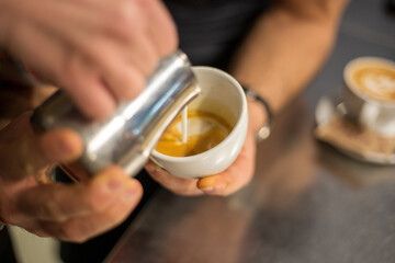 A barista Making coffee and cappuccino