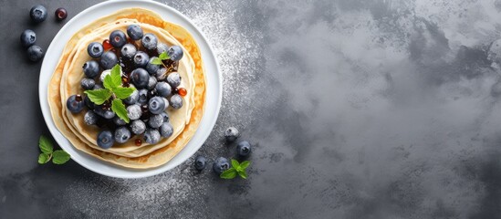 Observing Pancake day by enjoying a nutritious morning meal Scrumptious handcrafted chocolate crepes topped with blueberries showcased on a sturdy kitchen surface A bird s eye view with room
