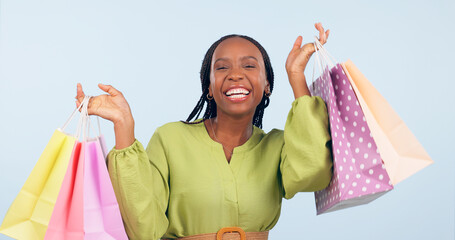 Black woman, shopping bag and retail in portrait with happiness for discount on fashion giveaway in...