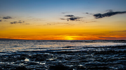 Sunset with a gradient of orange on the ocean, Sauzaie beach in Brétignolles-sur-Mer, Vendée, FRANCE.