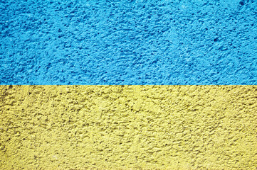 Flag of Ukraine. Spray painted graffiti grunge stone wall. Courage concept. Ukrainian national colors background. 