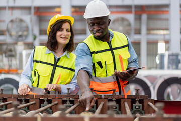 female engineer supervisor advice technician foreman to inspect spare part equipment of production...