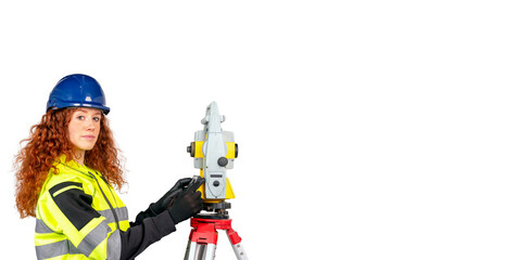 Construction site engineer woman in safety equipment working with surveying total station EDM instrument isolated on white background. Building, developing, construction and architecture concept.