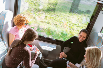group teenage female students travels by train © larisikstefania