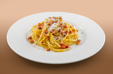 Plate of spaghetti carbonara with black pepper and pecorino cheese