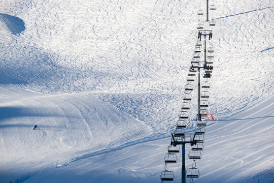 Winter journey unfolds cable car amid Andorra's snowy peaks alpine wonder