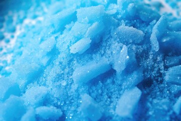 Zoomed-in image of blue granulated laundry detergent. - obrazy, fototapety, plakaty