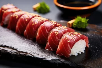 Fotobehang Japanese-style sushi tuna served on a ceramic dish with a selective focus on the background. © The Big L