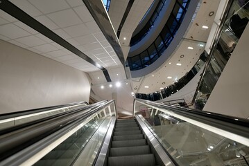 Close-up shot of empty moving staircase running up and down.