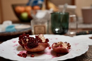 Juicy pomegranates on a ceramic plate