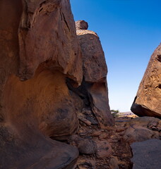 Africa, Mauritania. Giant fragments of rocks of volcanic origin on the rocky plateau of the Agrour...