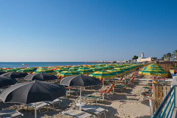 parasols on the sandy beach in Manfredonia town,