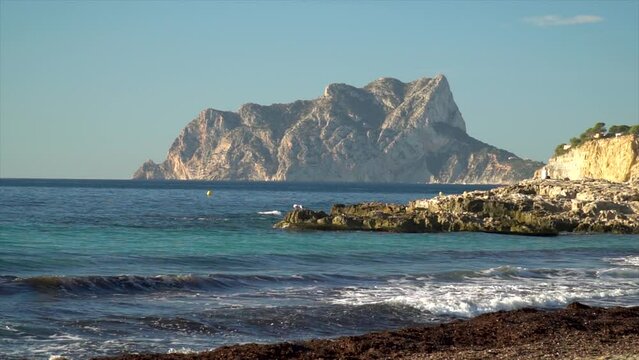 Mediterranean sea, Calpe rock over the horizon in the morning.