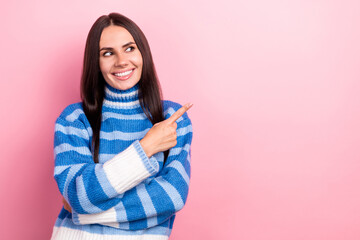 Photo of pretty cheerful lady beaming smile look direct finger empty space offer novelty isolated on pink color background