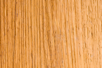 The background of the wall with the texture of boards painted with orange paint