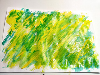 Background made of an abstract painting with watercolor paints with water stains, waves and lines in yellow and green colors. Texture, pattern, frame, copy space