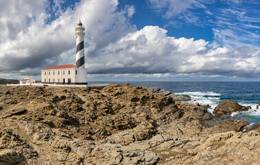 Favaritx Lighthouse at north coast of Menorca (Balearic Islands)