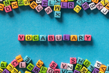 vocabulary word from multicolored letters on blue background, learn language