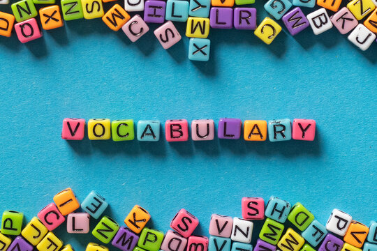 vocabulary word from multicolored letters on blue background, learn language