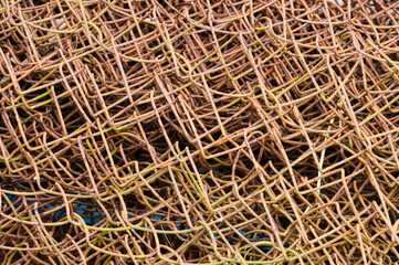 Rusty mesh in a roll close-up with square holes