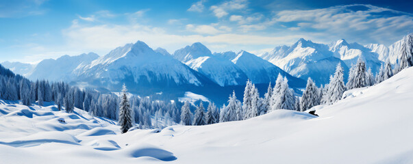 Panoramic view of a snowy mountain range. The mountains are covered in snow and the valley is surrounded by trees. The sky is a clear blue and there are a few clouds in the distance. - obrazy, fototapety, plakaty