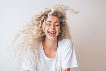 Innocent woman shaking her curly blonde hair