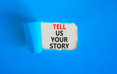 Tell us your story symbol. Concept word Tell us your story on beautiful white paper. Beautiful blue paper background. Business tell us your story concept. Copy space.