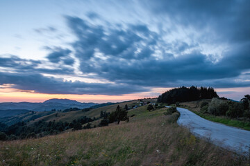 A view of a mountain road at dusk
