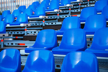 Dark blue rows of seats on the stadium.