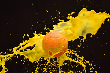 Yellow splashes on the basketball