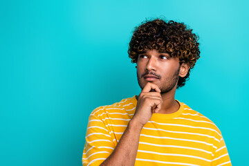 Fototapeta na wymiar Photo portrait of nice young male look minded empty space wear trendy striped yellow garment isolated on aquamarine color background