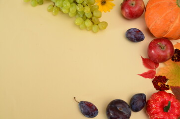 Assortment of fruits, grapes and nuts. Autumn seasonal harvest. pumpkin apples, red, yellow leaves. food still life with season fruits. Thanksgiving day, Halloween decoration fall design