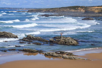 Beautiful Almograve beach with black basalt rocks in Portugal