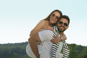 Romantic date. Beautiful couple spending time together outdoors, space for text