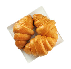 Plate with delicious fresh croissants isolated on white, top view